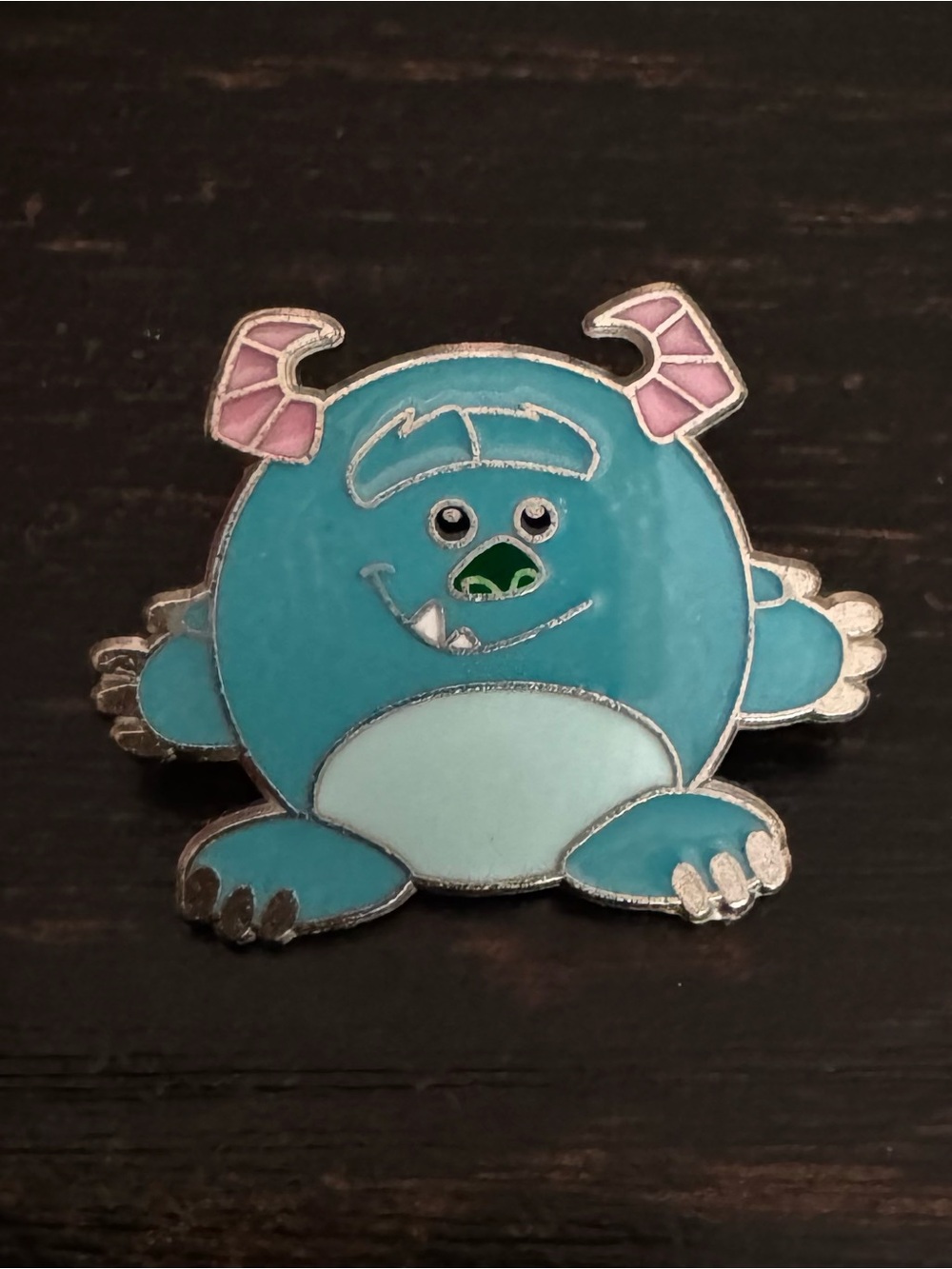Authentic Disney Parks trading pin features Sulley from Monsters, Inc.